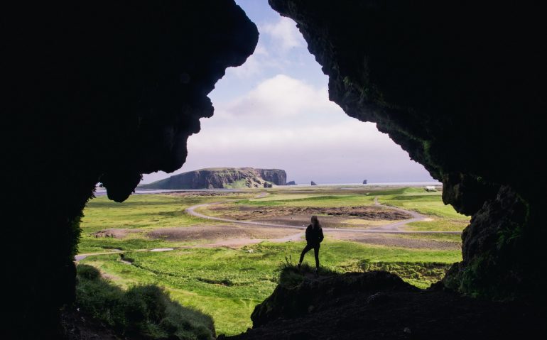 woman-standing-rock-formation-daytime (1)